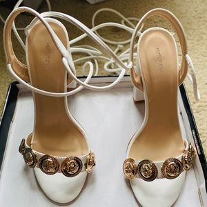 Cute white strappy heels.